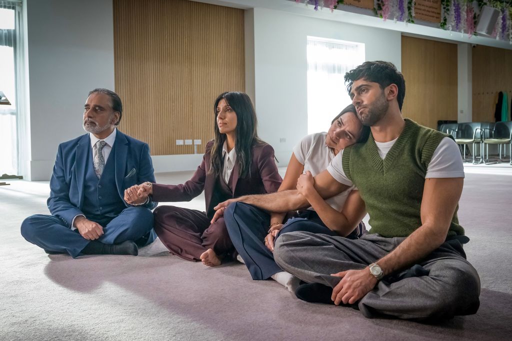 group of people sitting on floor