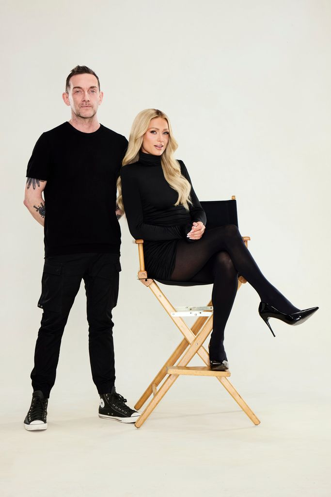 Paris Hilton sits on a director's chair