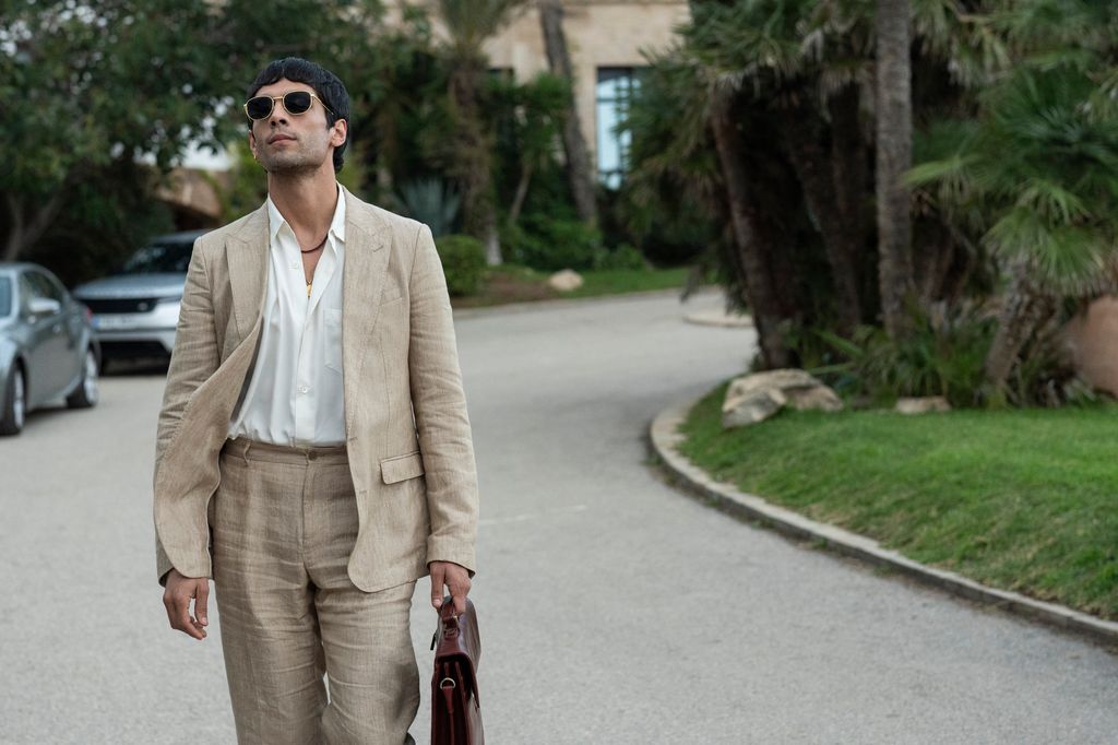 man in suit walking in street