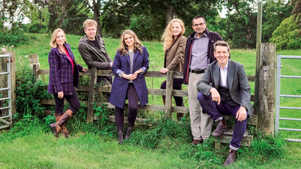 group of presenters in field