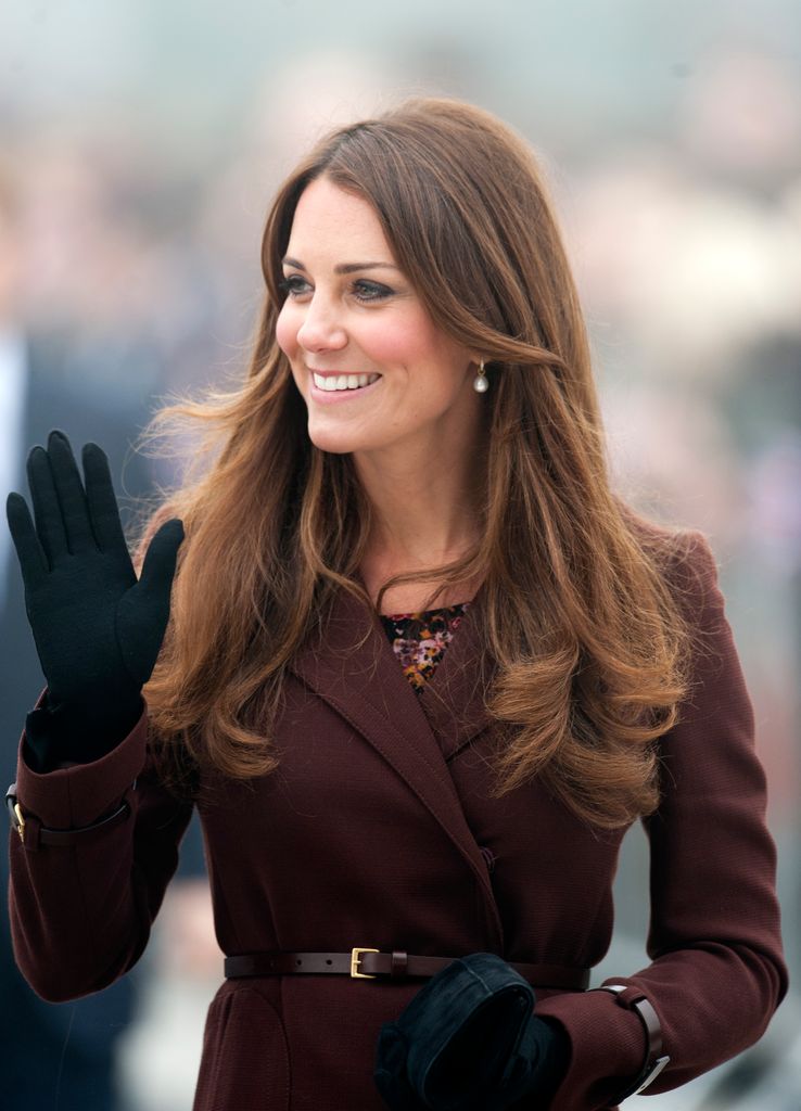 Kate Middleton wearing a brown coat during her official visit to Grimsby on March 5, 2013 in Grimsby, England. 