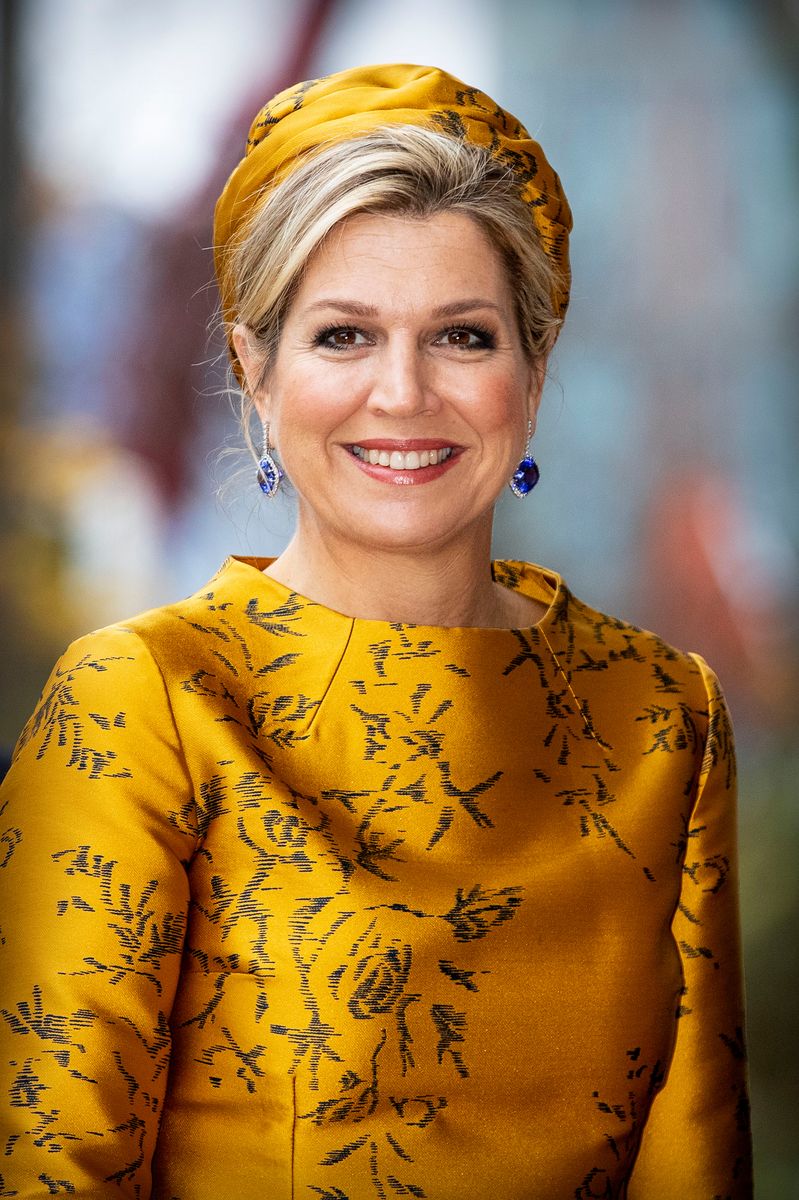 Exactly as she did eight years ago, Queen Maxima paired the Natan two-piece with the same suede pumps and matching turban that crowns her chic updo.