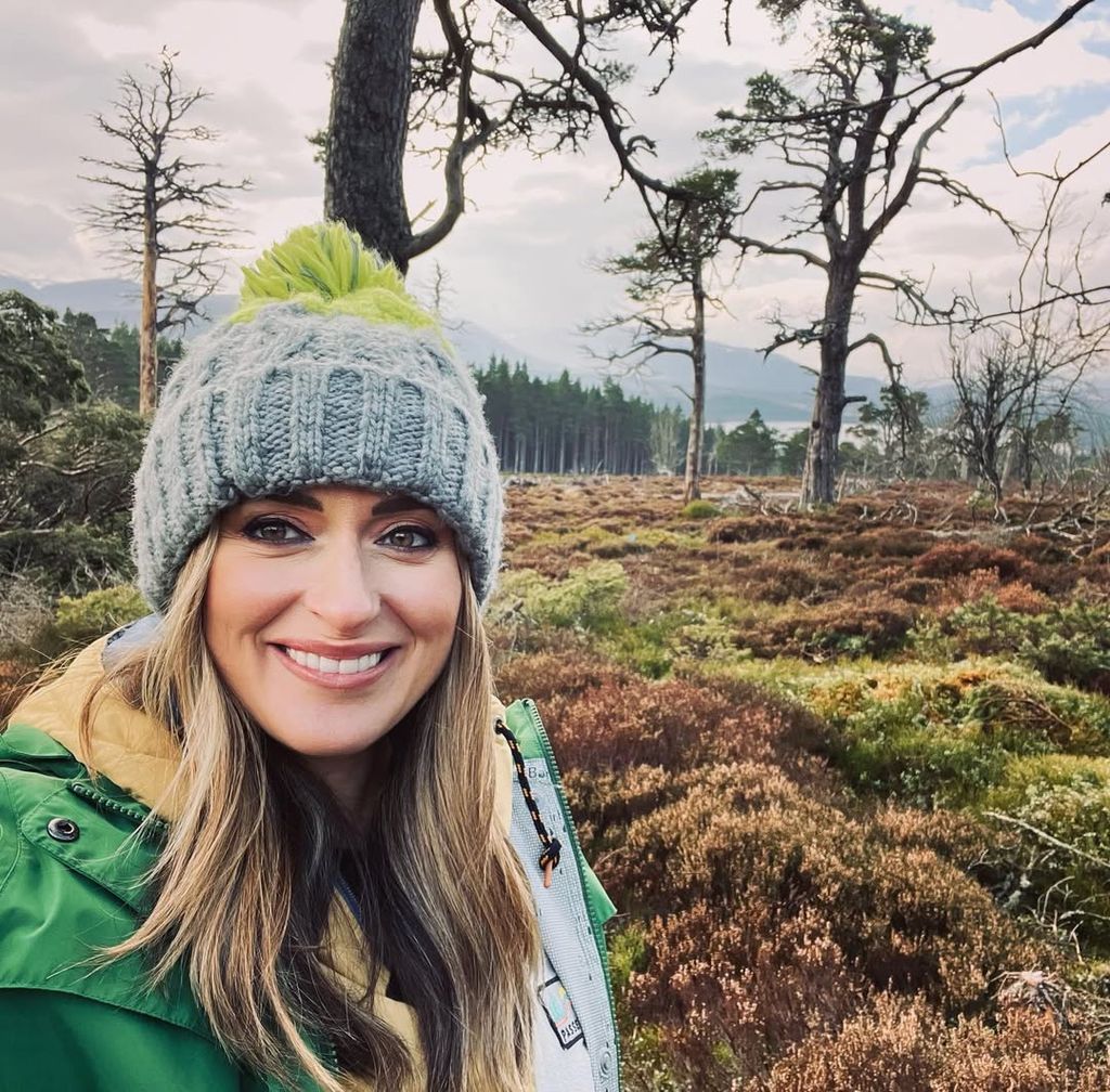 woman taking selfie in woodland