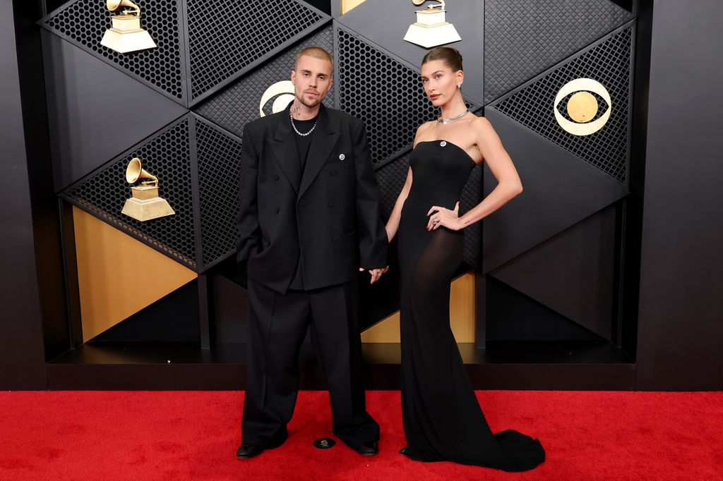 LOS ANGELES, CALIFORNIA - FEBRUARY 01: (FOR EDITORIAL USE ONLY) (L-R) Justin Bieber and Hailey Bieber attend the 68th GRAMMY Awards at Crypto.com Arena on February 01, 2026 in Los Angeles, California. (Photo by Amy Sussman/Getty Images)
