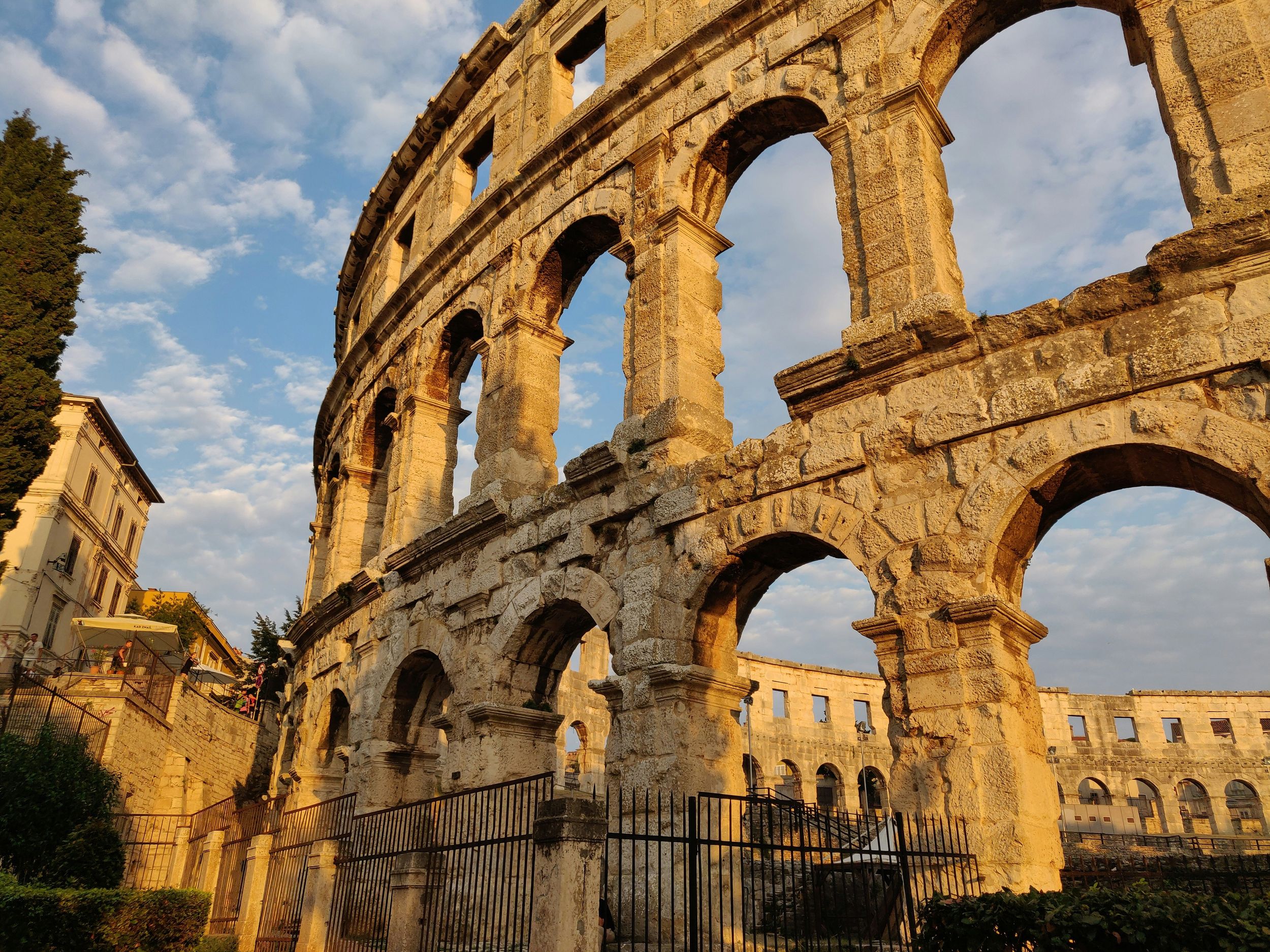 Ancient architecture in Pula, Croatia against a blue sky