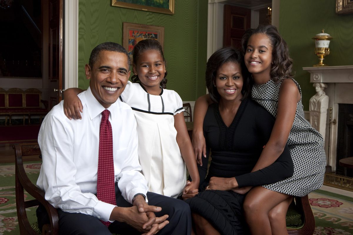 In this handout form the White House, (L to R) U.S. President Barack Obama, daughter Malia Obama, first lady Michelle Obama and daughter Sasha Obama sit for portrait in the Green Room of the White House September 1, 2009 in Washington, DC. 