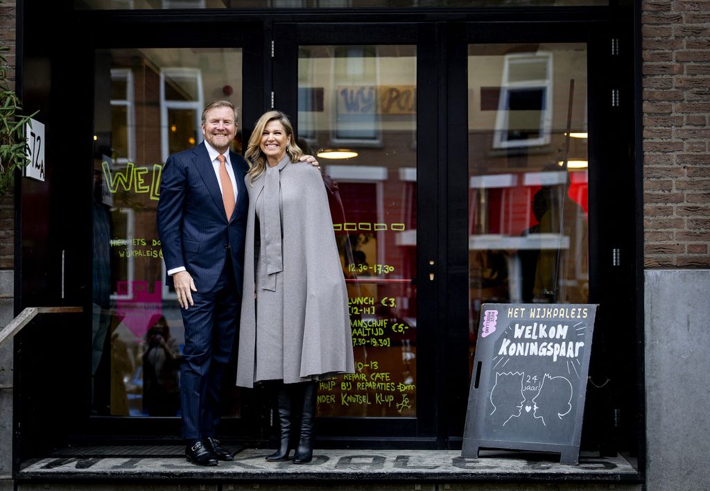 King Willem-Alexander and Queen Maxima of the Netherlands pose upon arrival at the Wijkpaleis community centre