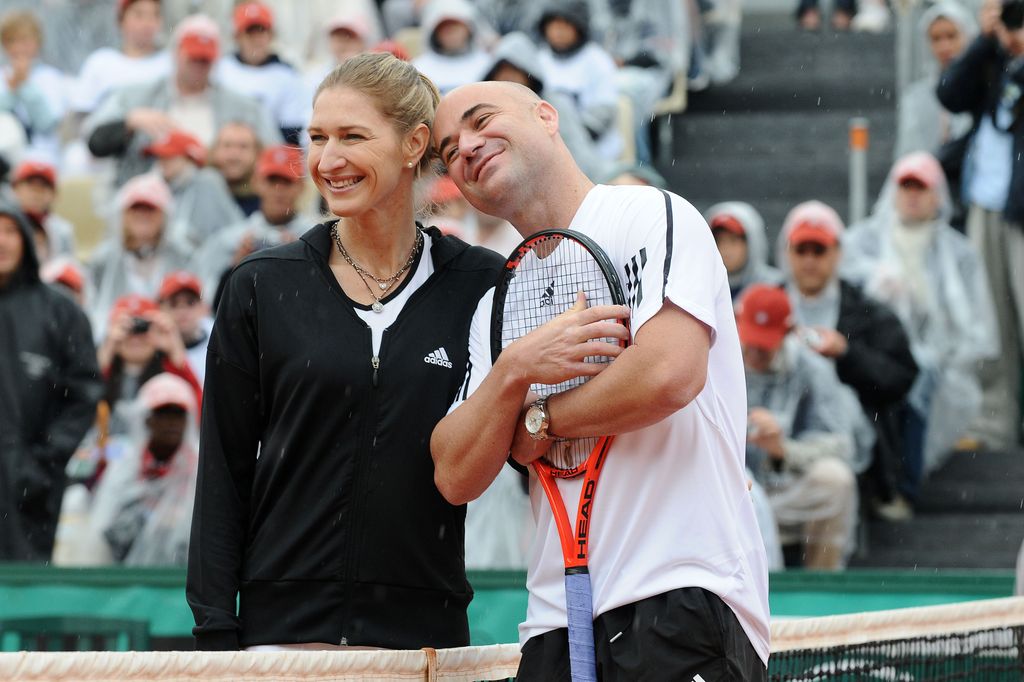 andre agassi and steffi graf on tennis court