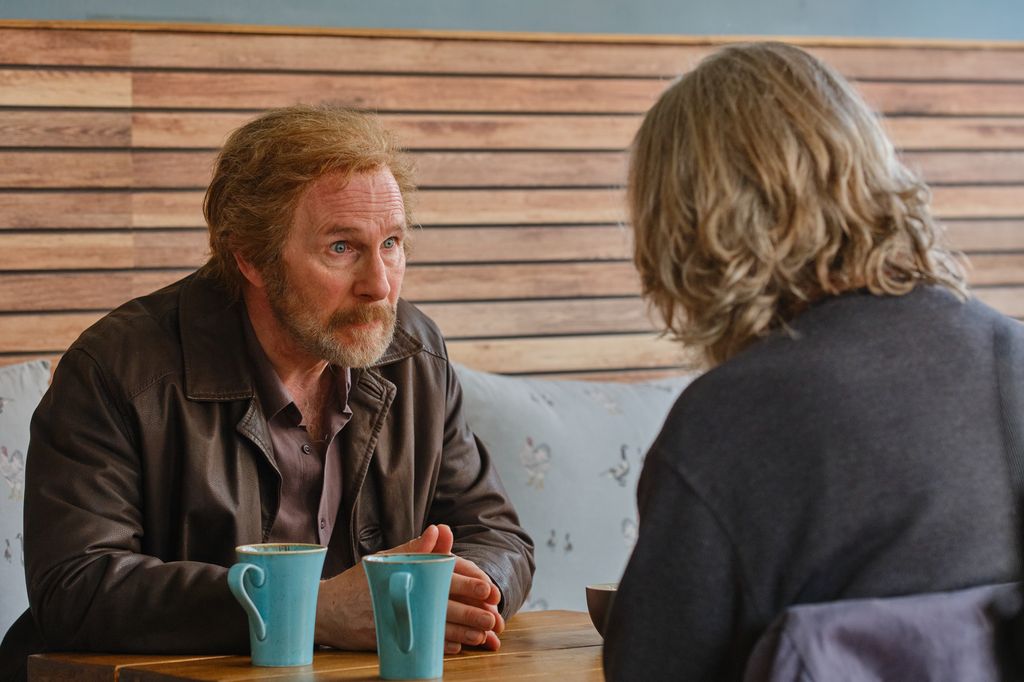 two men sitting in cafe