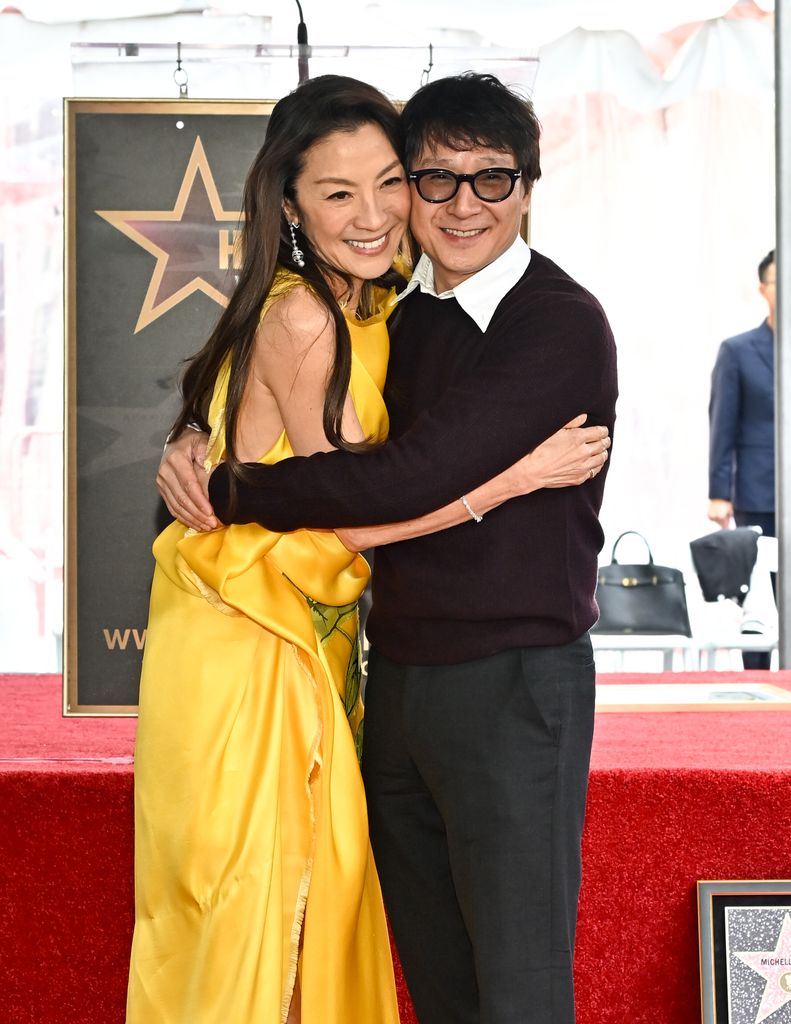 Michelle Yeoh and Ke Huy Quan walk of fame hugging