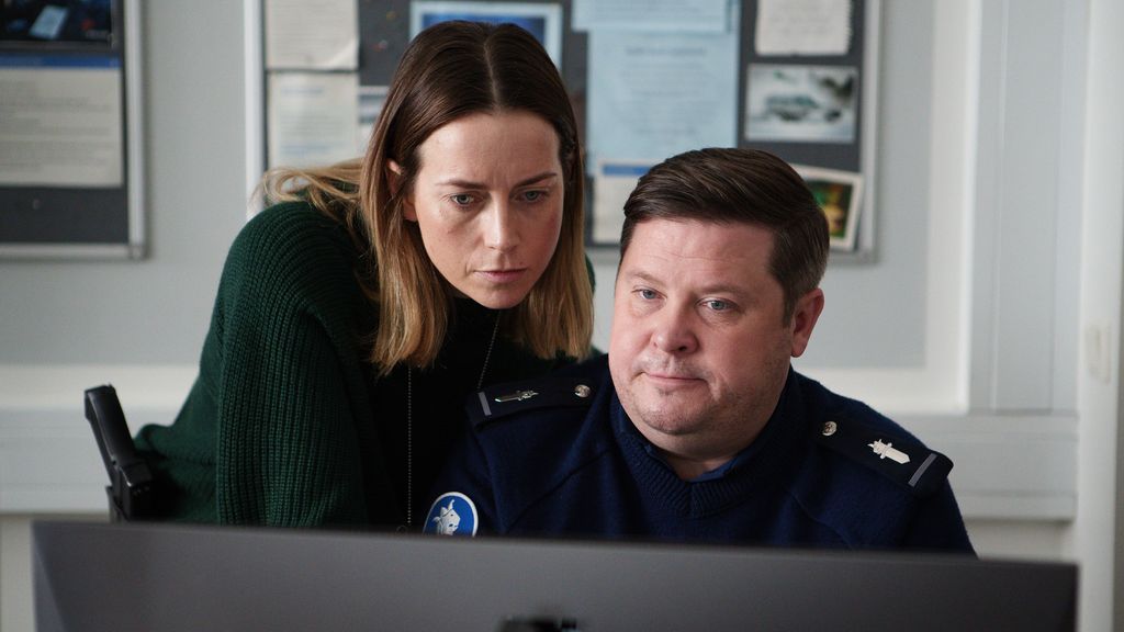 two police officers looking at computer screen