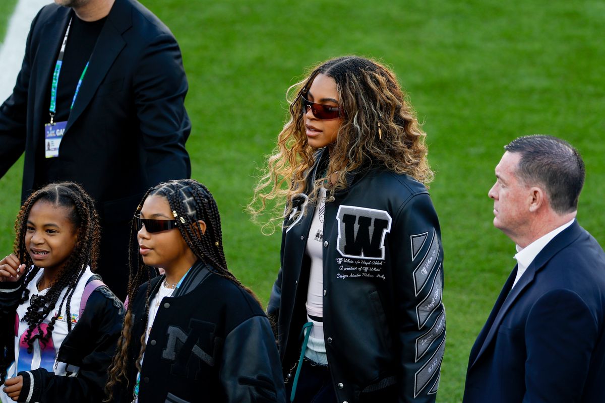 Blue Ivy is seen walking on the field in Levi's Stadium during the pregame at Super Bowl LX between the Seattle Seahawks and New England Patriots.