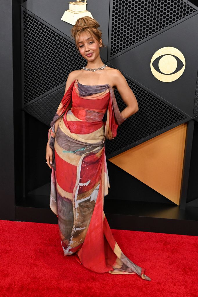 PinkPantheress wearing a strapless corset dress in red, white and blue stripes