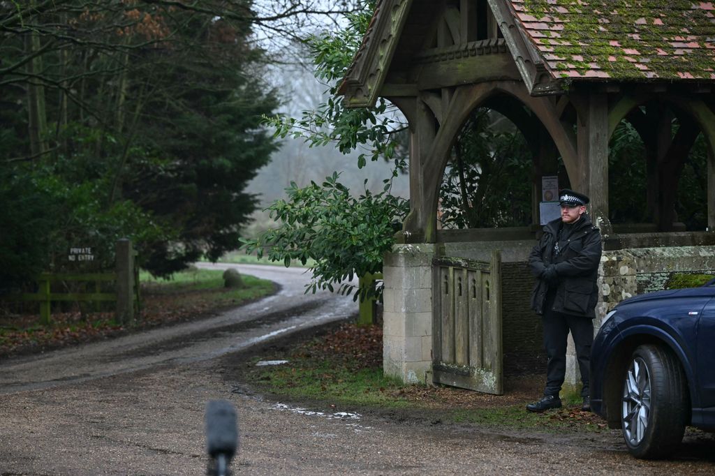 A policeman stands at an entrance to Wood Farm on the royal family's Sandringham Estate in Norfolk, eastern England on February 19, 2026, where former prince Andrew was arrested earlier in the day