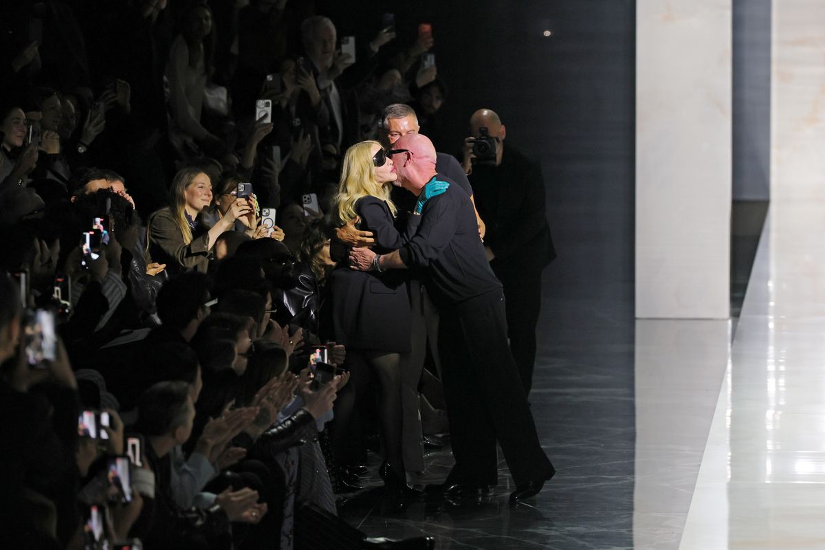 Madonna, Designer Domenico Dolce and Designer Stefano Gabbana greet each other at the Dolce&Gabbana fashion show during the Milan Womenswear Fall/Winter 2026/2027 Fashion Week