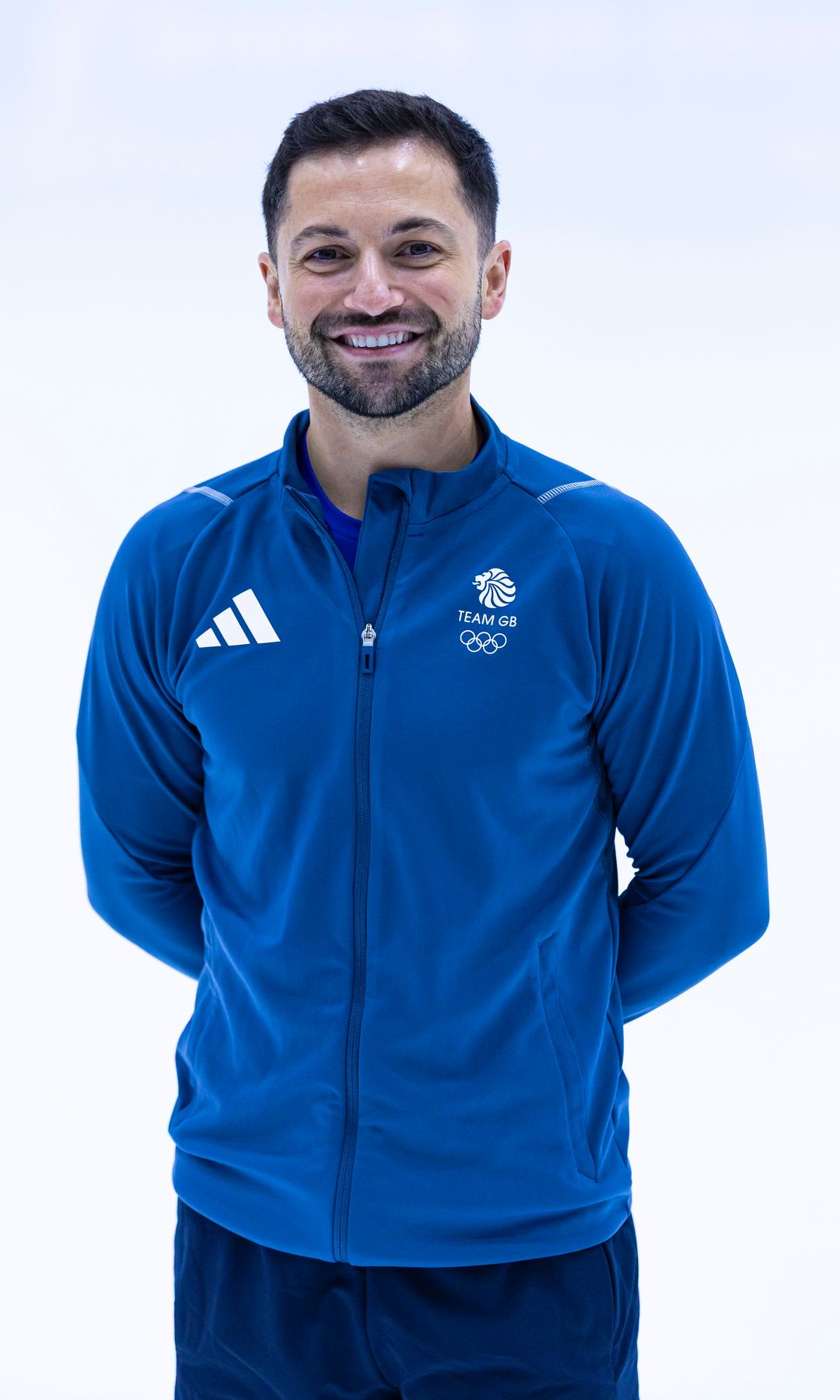 Lewis Gibson in a blue jacket