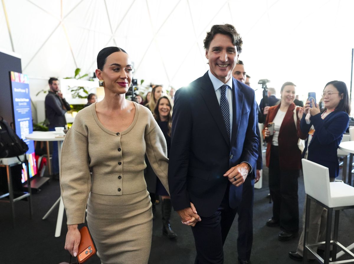 Former Prime Minister Justin Trudeau holds hands with Katy Perry at the World Economic Forum in Davos