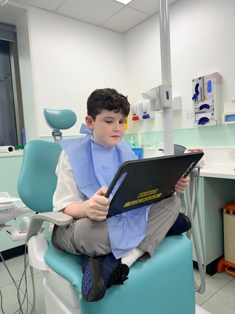 boy in eye clinic looking at screen