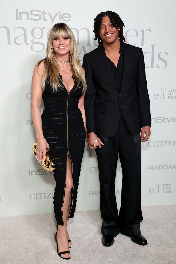 Heidi Klum in black dress and Henry Samuel in black suit at the InStyle Imagemaker Awards 2025