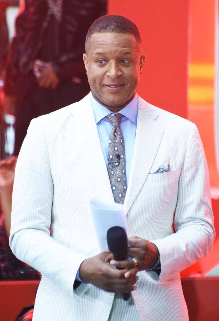 craig melvin holding microphone on stage