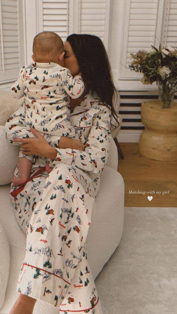 Michelle Keegan cradling baby Palma wearing matching Christmas pyjamas