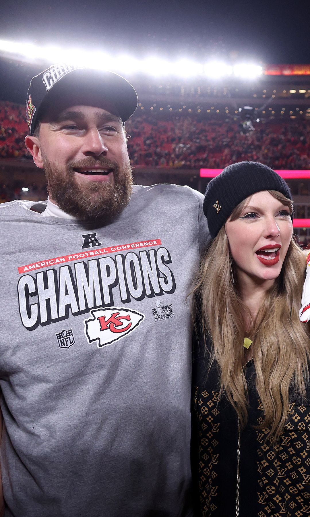 KANSAS CITY, MISSOURI - JANUARY 26: Taylor Swift celebrates with Travis Kelce #87 of the Kansas City Chiefs after defeating the Buffalo Bills 32-29 in the AFC Championship Game at GEHA Field at Arrowhead Stadium on January 26, 2025 in Kansas City, Missouri.  (Photo by Jamie Squire/Getty Images) 