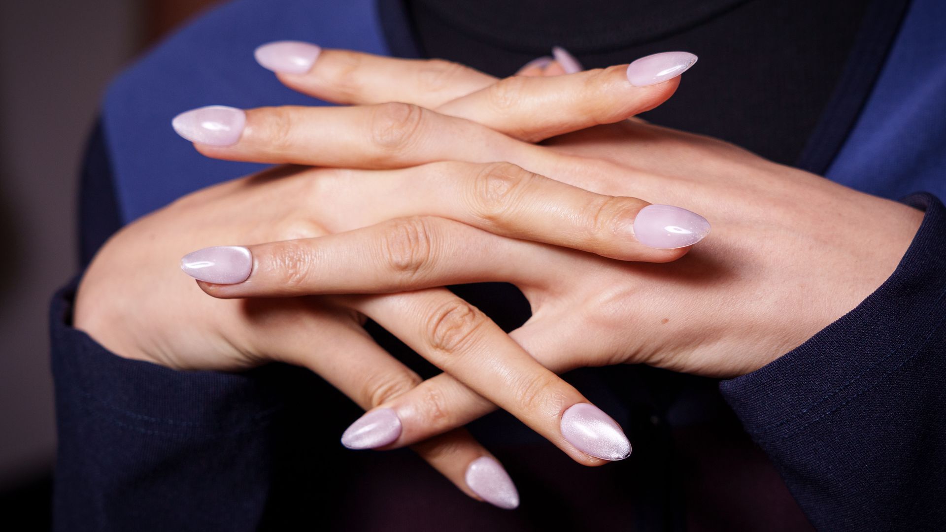 Press-on nails allow you to trial trends like these milky cats eye nails at Kate Barton