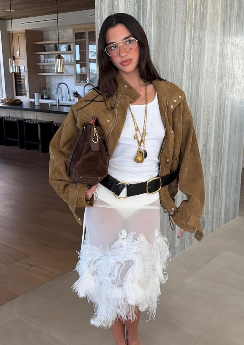Dua’s recent days have also been filled with creative projects and glamorous outings. She was seen in a sheer feather-trimmed white dress layered under a suede jacket in LA.