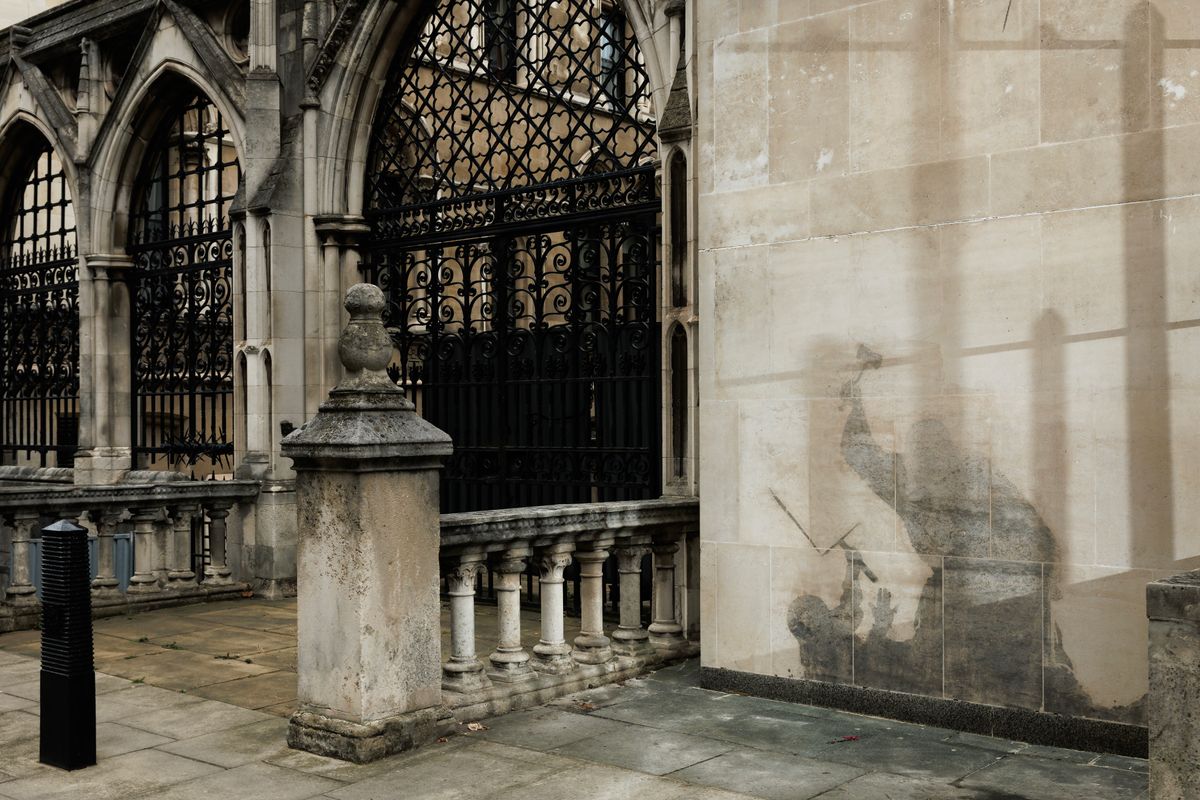 The mural, which depicted a judge raising a gavel over a cowering protester holding a blood-splattered placard, was removed from the Grade I listed building within days after it first appeared.