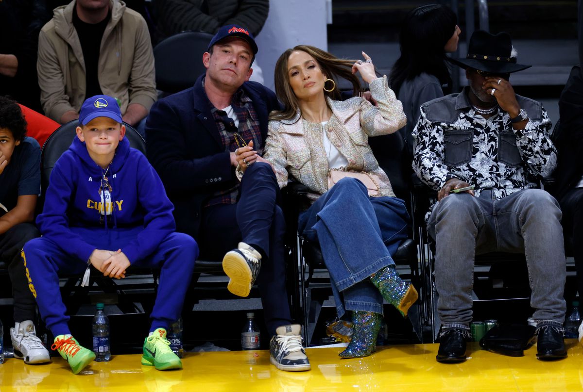 Ben Affleck his son Samuel Garner Affleck and Jennifer Lopez wait to greet Stephen Curry.
