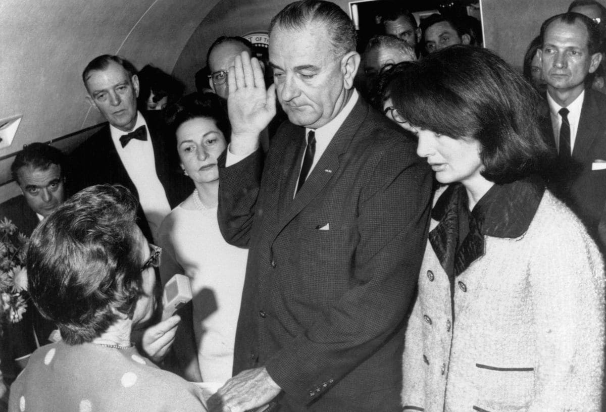 Vice President Lyndon B Johnson is sworn in to the office of the Presidency aboard Air Force One in Dallas, Texas, hours after the assassination of President John F Kennedy. 