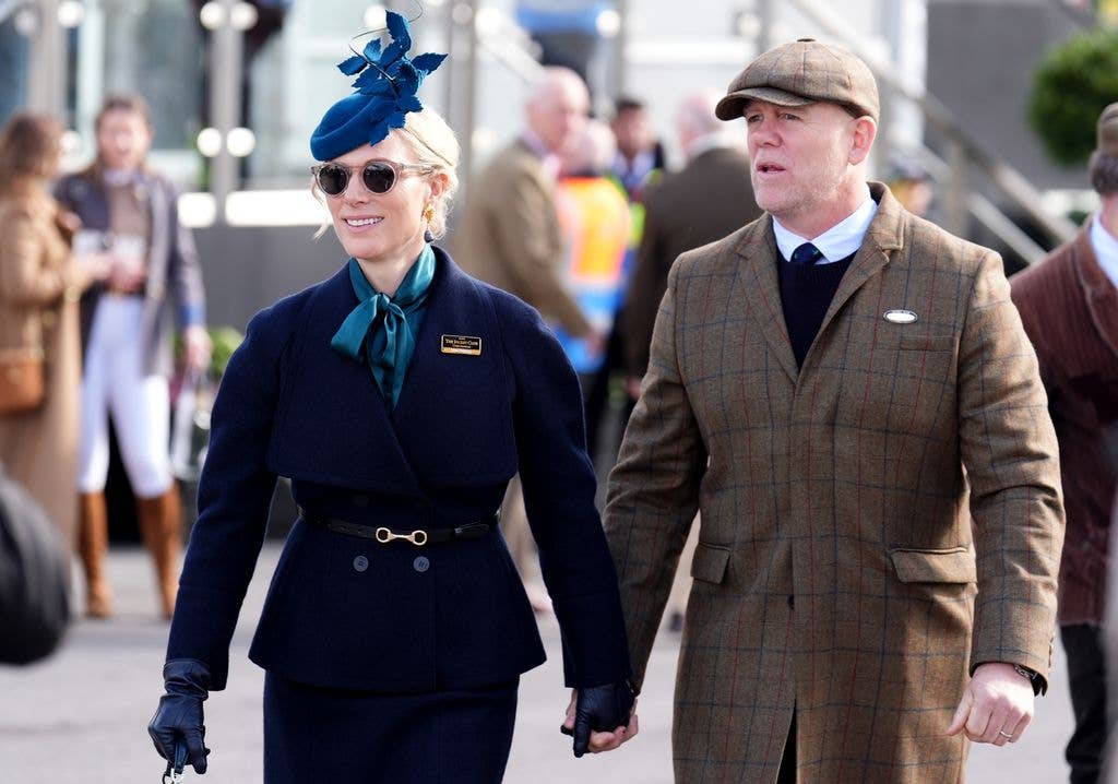 Zara Tindall in navy hat and outfit with mike in tweed
