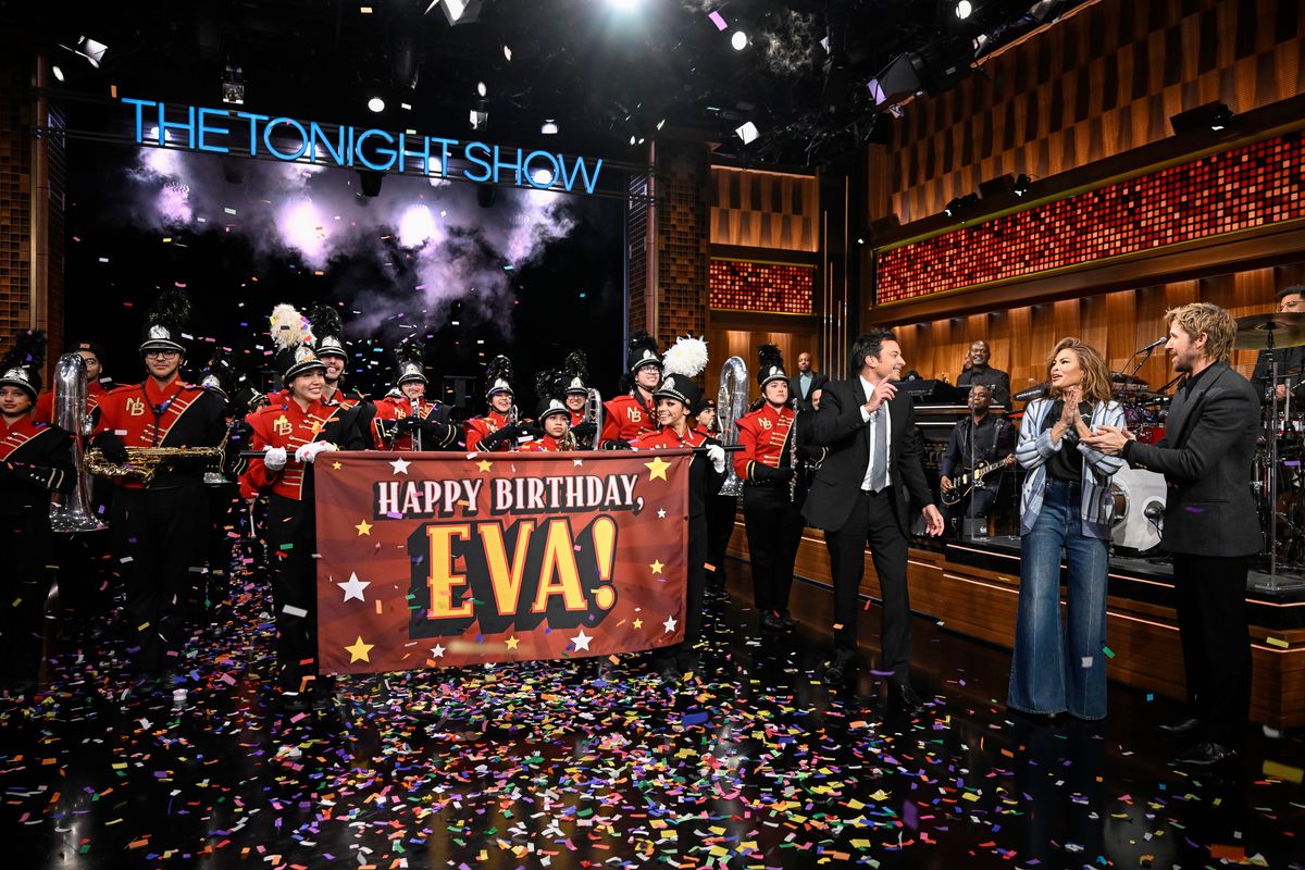 Students carried a large flag that read “Happy Birthday, Eva!” while confetti filled the air.