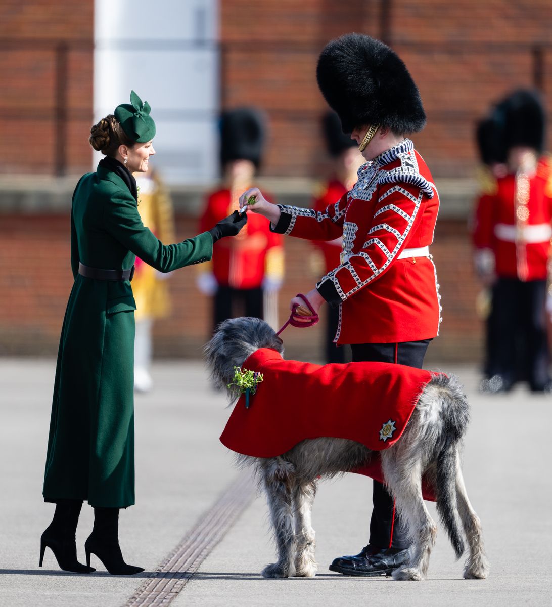 Catherine, Princess of Wales anchored her look with a forest-green, double-breasted wool coat by Alexander McQueen, tailored with sharp lapels and structured shoulders.