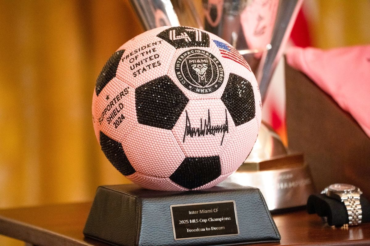 Messi held a commemorative soccer ball mounted on a trophy-style base during part of the presentation.