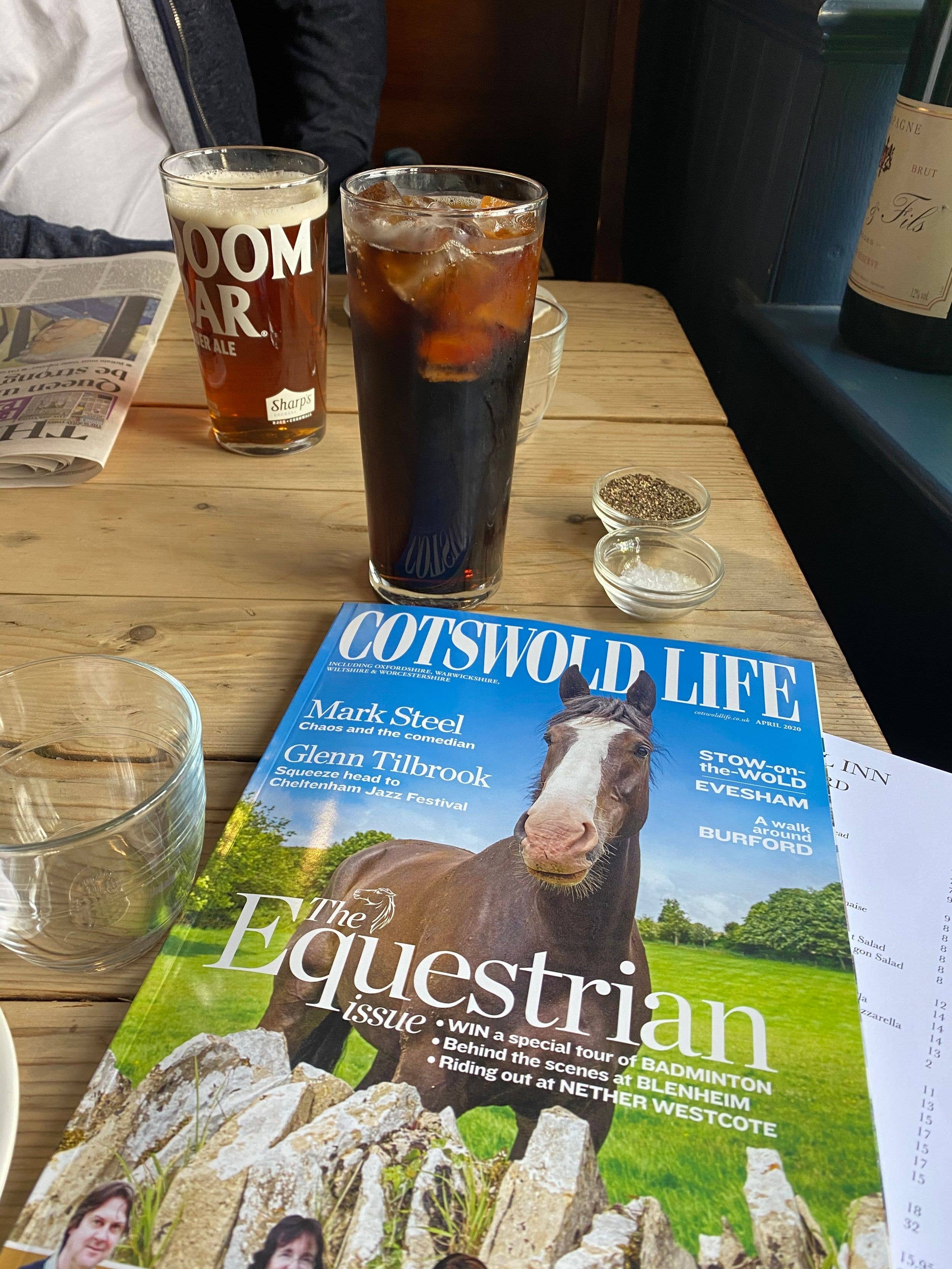 pub table with magazine and drinks 