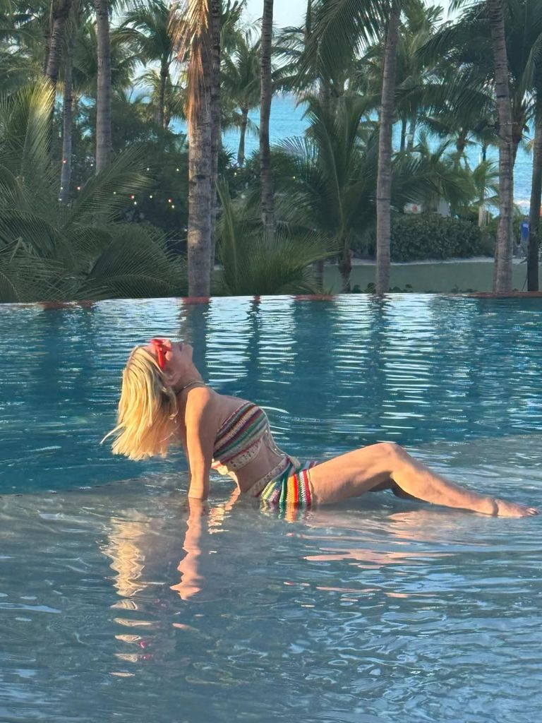 Tori Spelling poses in a multicolored knit two-piece on vacation at Hyatt Bahamar Resort in Nassau, shared on Instagram