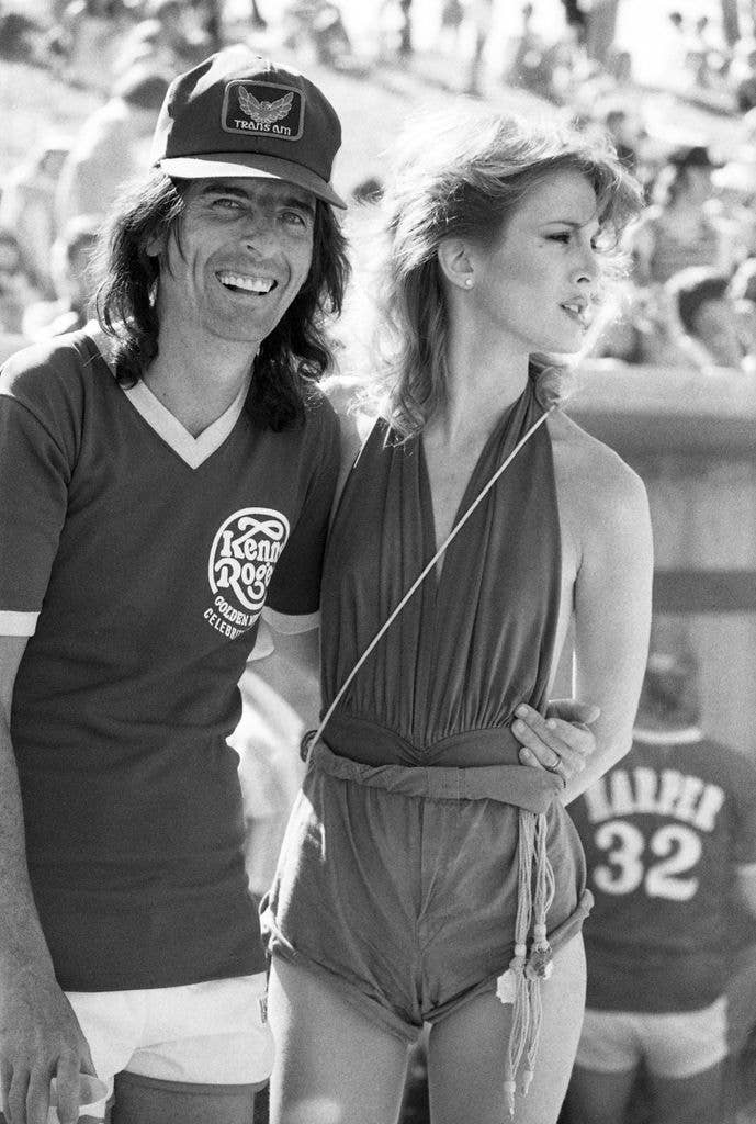 Singer, songwriter and musician Alice Cooper with his wife dancer Sheryl attend the Kenny Rogers Golden Nugget celebrity softball game to aid the Nevada Special Olympics at UNLV campus on May 29, 1977 