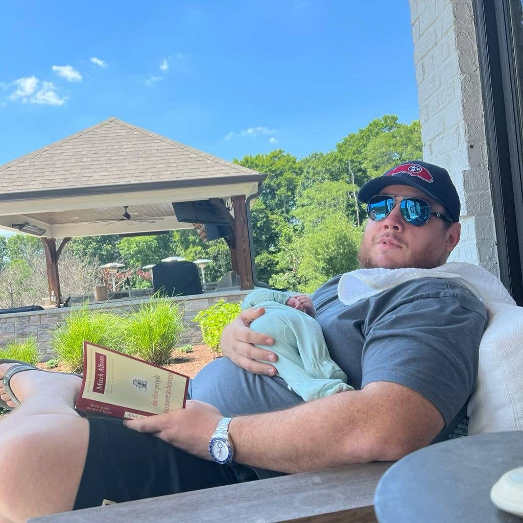 luke combs holding baby son beau