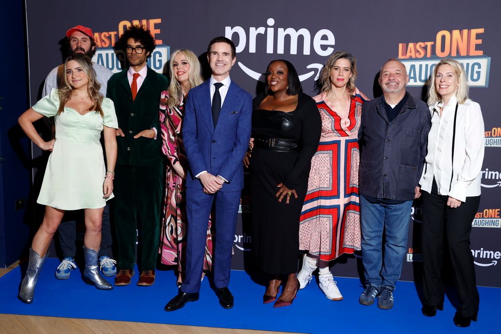 Harriet Kemsley, Joe Wilkinson, Richard Ayoade, Roisin Conaty, Jimmy Carr, Judi Love, Lou Sanders, Bob Mortimer and Sara Pascoe pose for photo on blue carpet at the Last One Laugh premiere