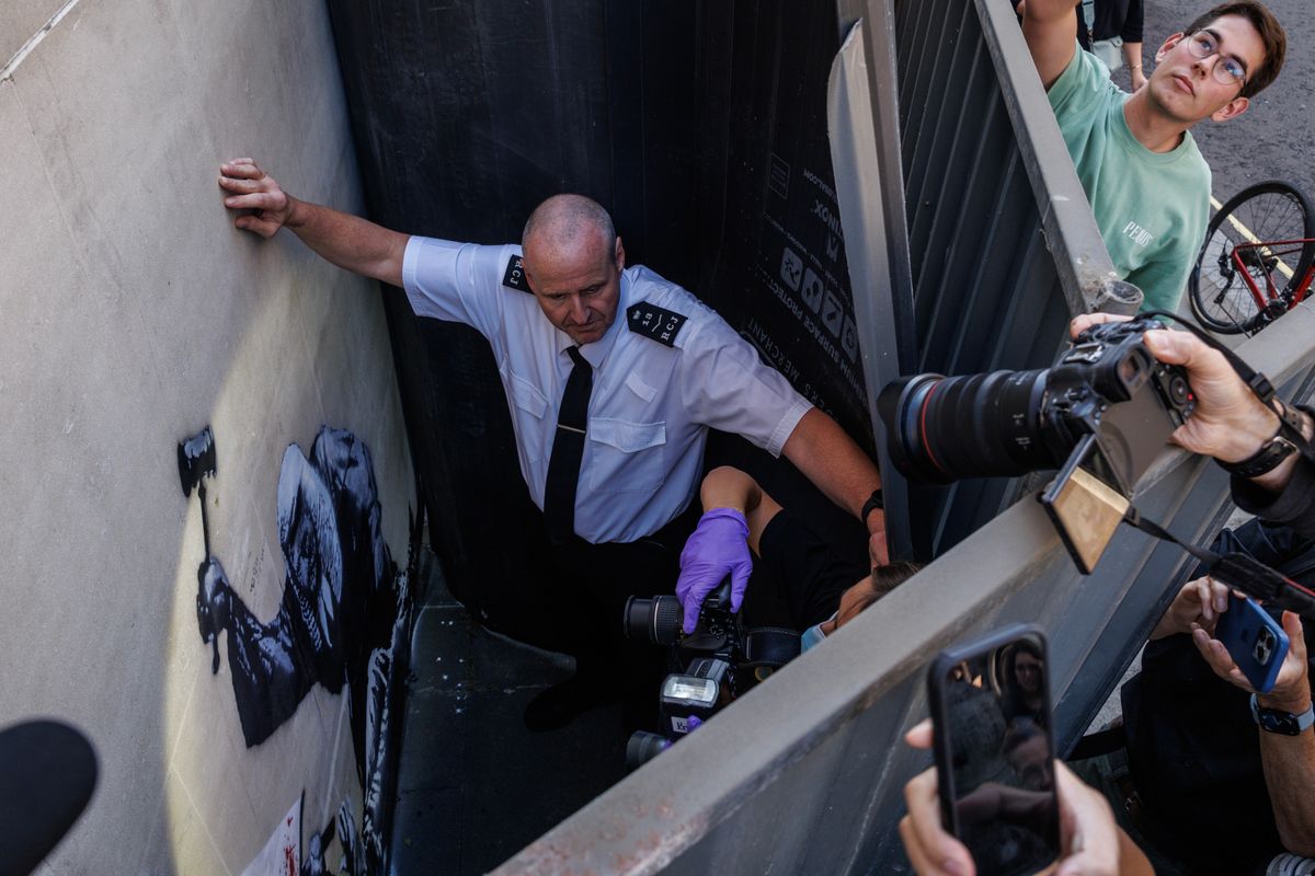 Banksy posted a photograph of his latest mural on the side of the Royal Courts of Justice, depicting a Judge beating a protester. 