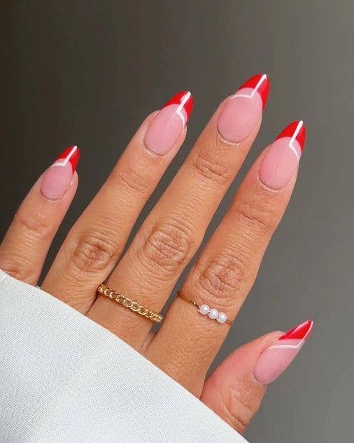 Red French manicure tips on a clear base for short nails