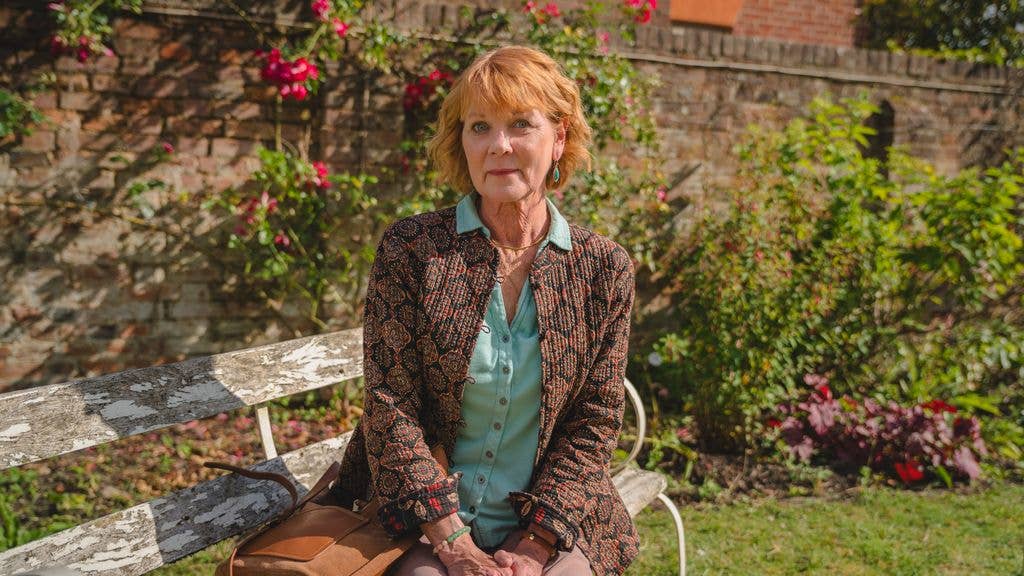 Woman sitting on park bench