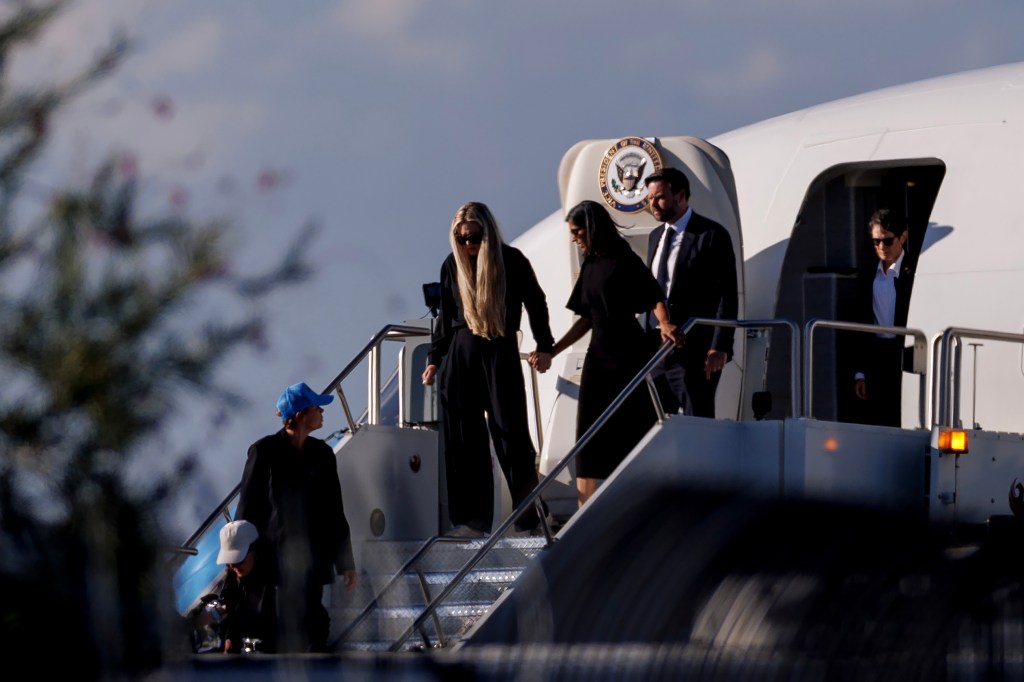 PHOENIX, ARIZONA - SEPTEMBER 11: Vice President JD Vance (R) second lady Usha Vance (C) and Erika Kirk deplane Air Force Two while escorting the body of Charlie Kirk on September 11, 2025 in Phoenix, Arizona. Kirk, the CEO and co-founder of Turning Point USA, was shot and killed on Wednesday in Utah. (Photo by Eric Thayer/Getty Images)