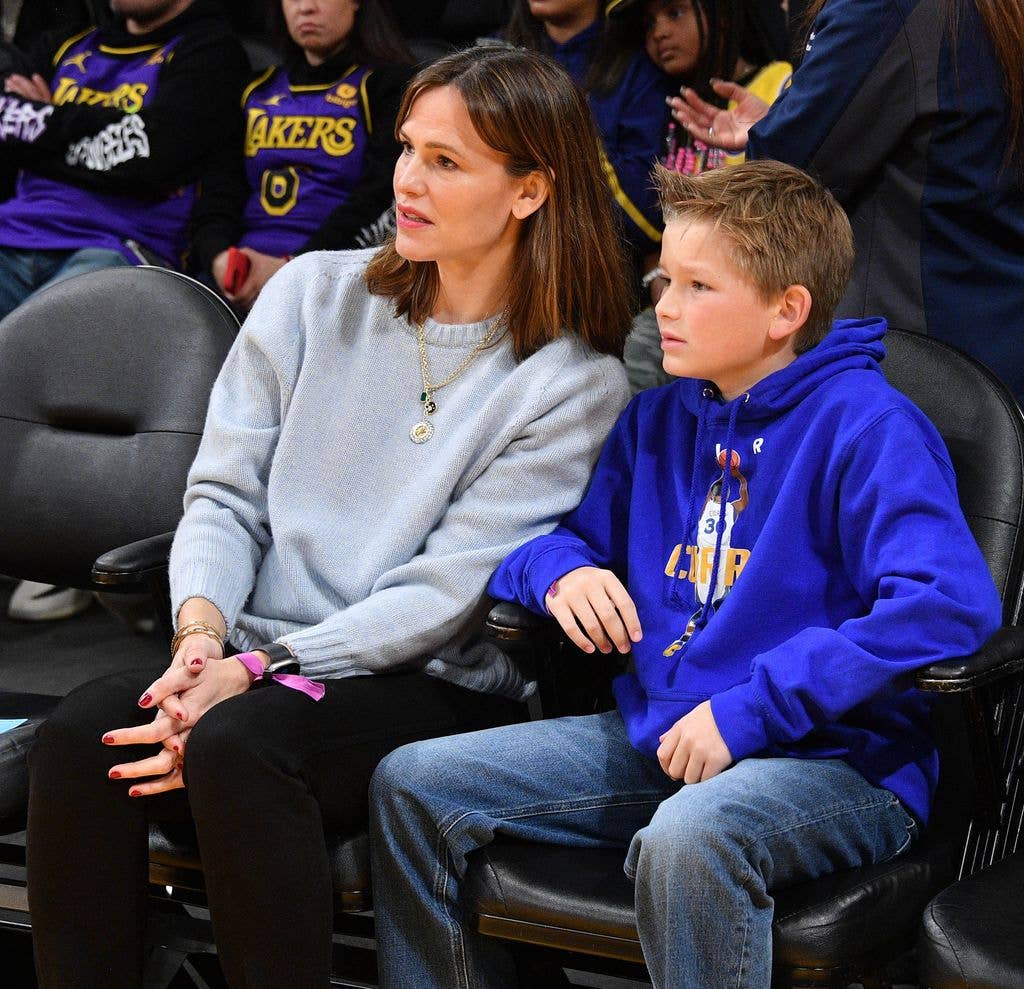 Jennifer Garner and her son Samuel Garner Affleck attend a basketball game between the Los Angeles Lakers and the Golden State Warriors at Crypto.com Arena on March 05, 2023 in Los Angeles, California. 