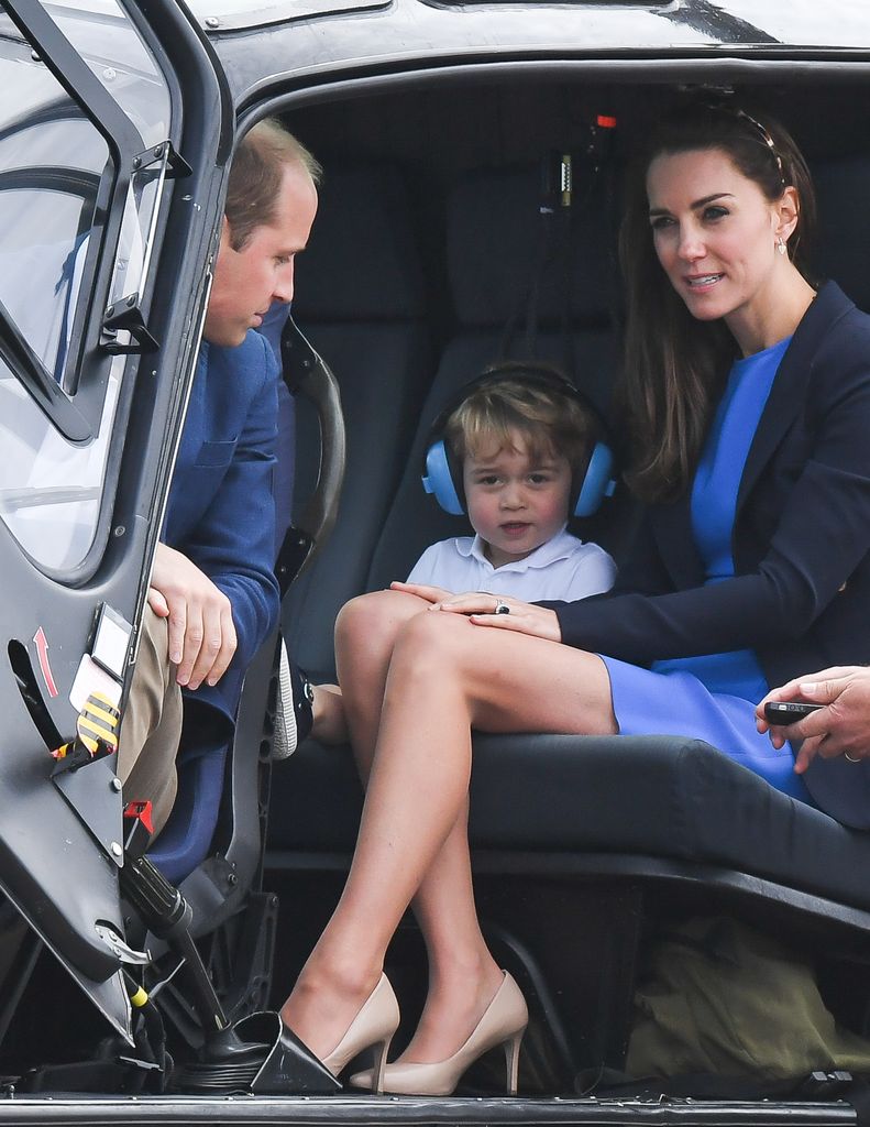 Prince George in a helicopter with william and kate
