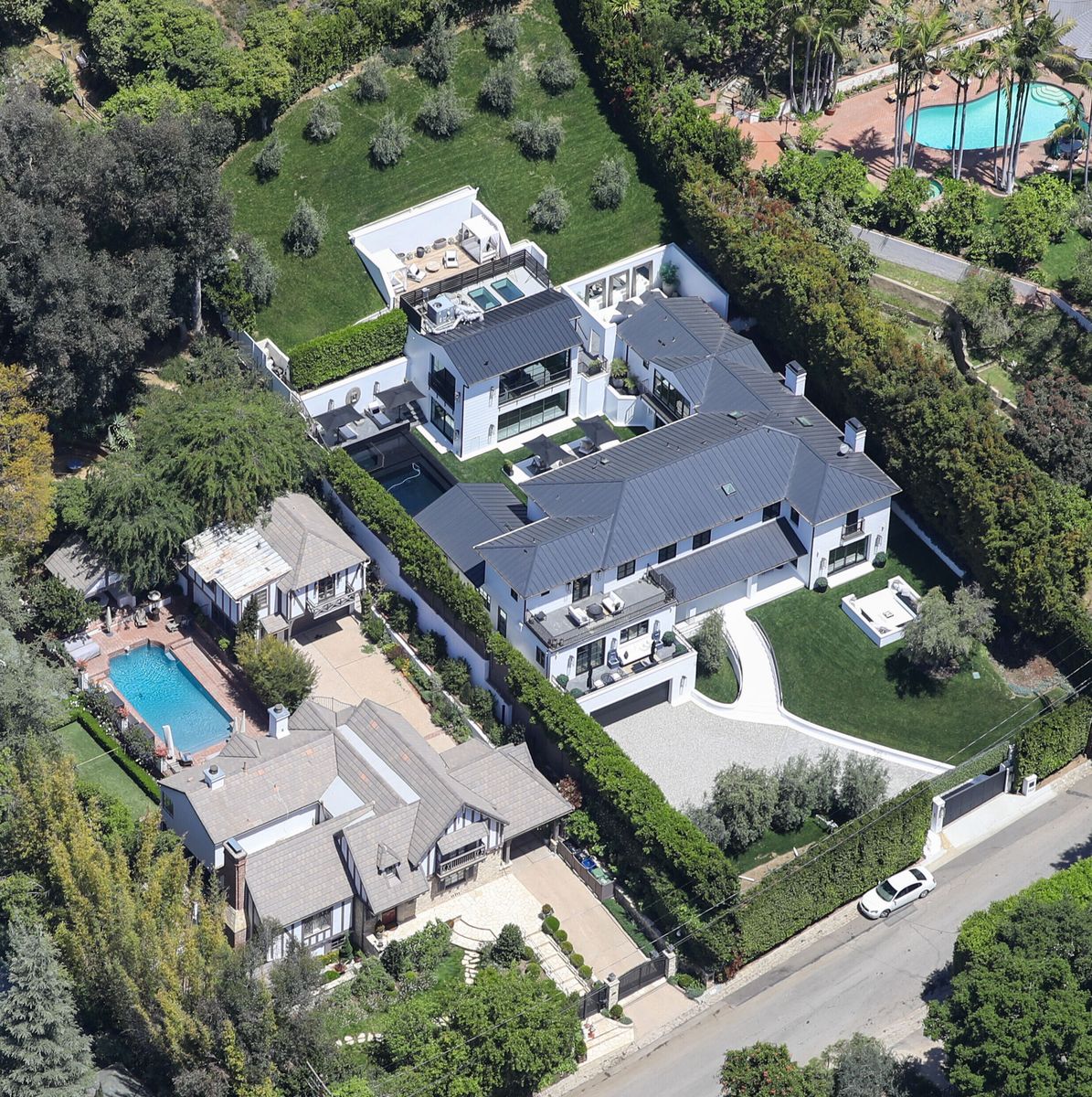 
Police blocked off the street in front of Rihanna's double mansion in Beverly Hills. Authorities arrested the suspect, who was reportedly carrying an assault rifle, while police said the motive behind the incident remains unclear.