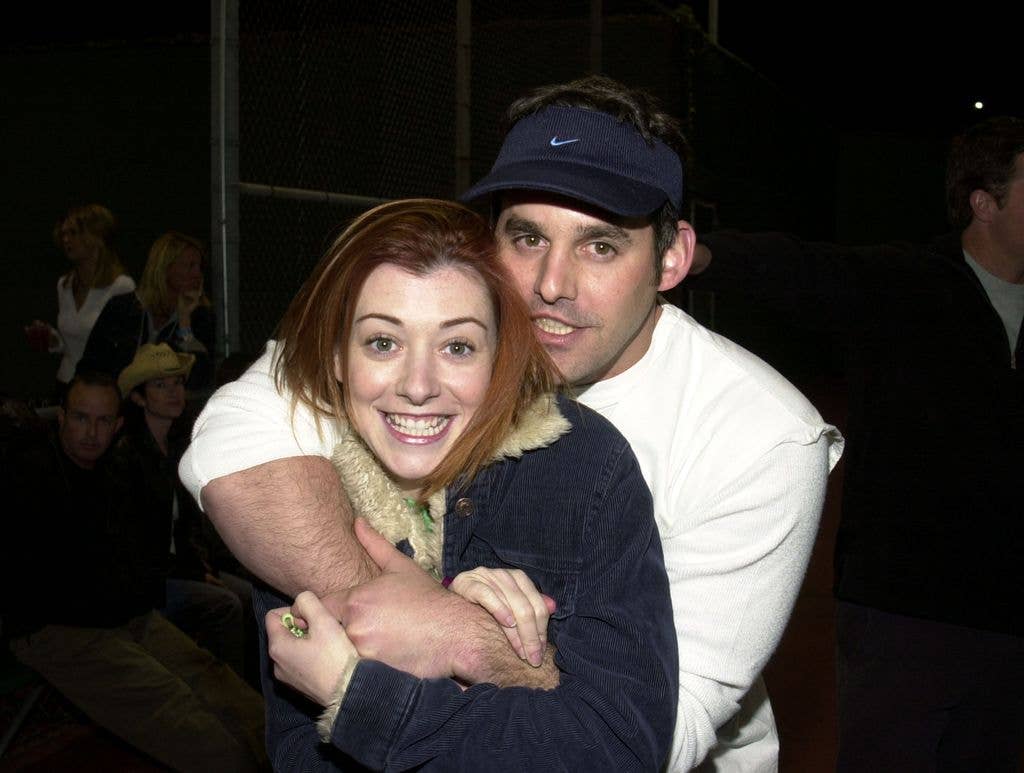 photo of alyson hannigan and nicholas brendon hugging