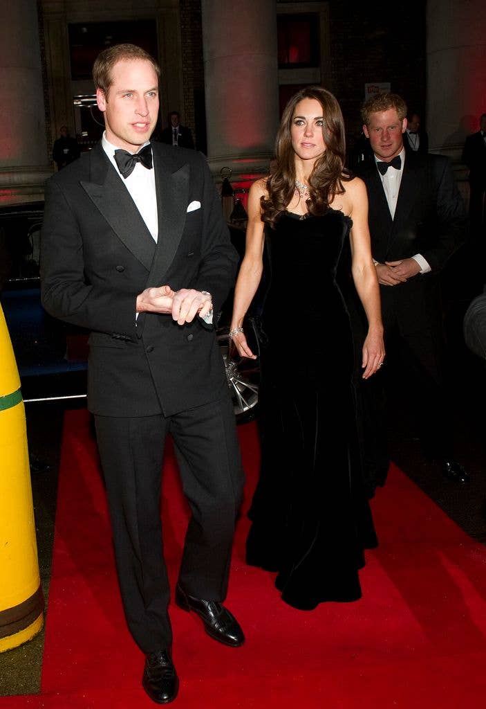 Prince William, Duke of Cambridge, Catherine, Duchess of Cambridge and Prince Harry in black on red carpet