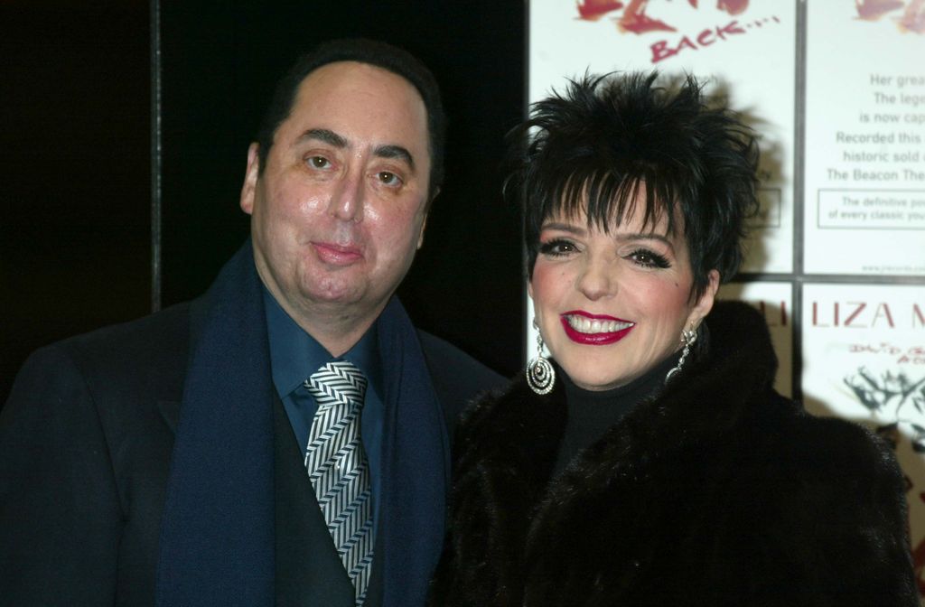 David Gest and Liza Minnelli smile at the camera at Tower Records in New York.